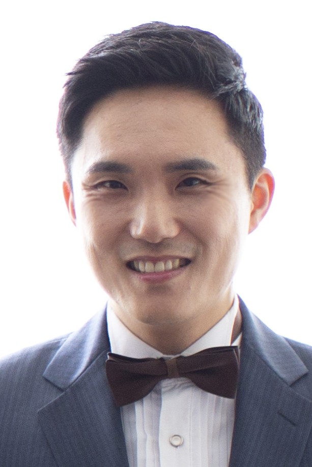 Professional headshot of Dr. Seunghoon Lee, 2026 Utility Policy Fellow and Assistant Professor of Economics, smiling and looking toward the camera.