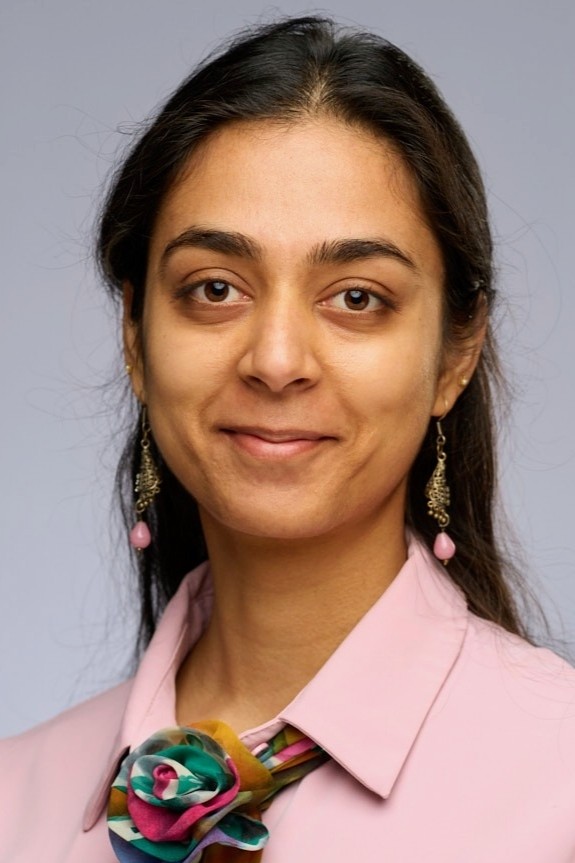 Professional headshot of Dr. Srishti Slaria, 2026 Utility Policy Fellow and Assistant Professor of Economics, smiling and looking toward the camera.